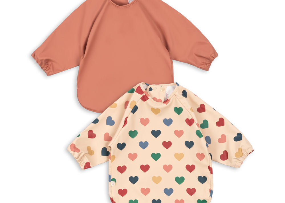 Konges Sløjd A/S Lätzchen coeur colore frappe/canyon rose